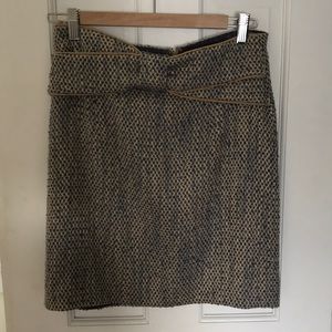 Wool blend woven pencil skirt with bow detail.